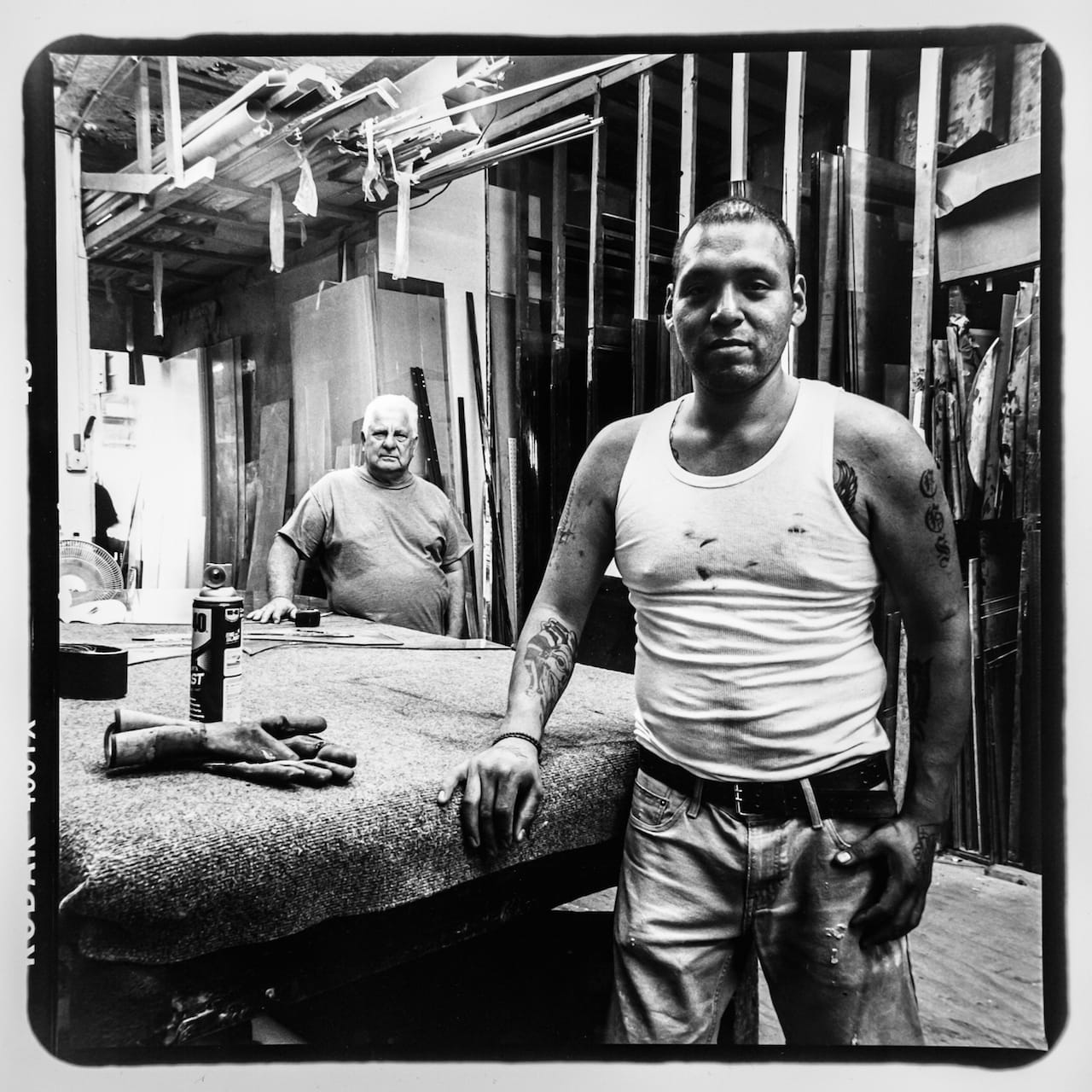 Kevin Mendoza (front) and Pepe (no last name) from Fordham Glass & Windows located on Jerome Avenue and 183rd. Kevin is retiring soon and Pepe will take over the business. Photo taken August 2015 by Jonathan Santiago/Bronx Photo League. 