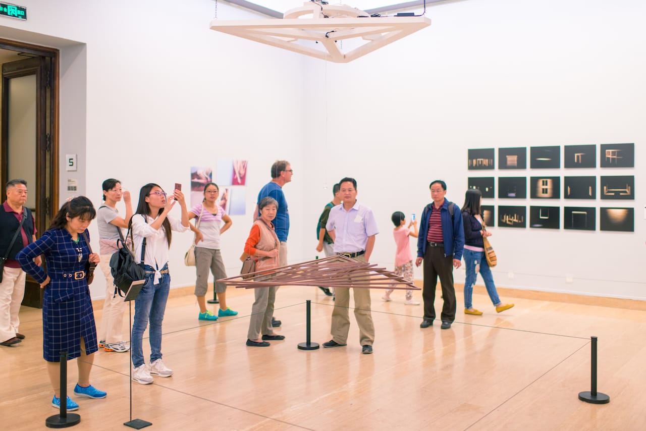 Visitors at the Armenian special exhibition viewing “HEUT #4 Dream Machine” (2015), a kinetic wooden sculpture and media projection by INVIVIA Studio and Ziyi Zhang (photo by Tobias Hildebrandt) (click to enlarge)