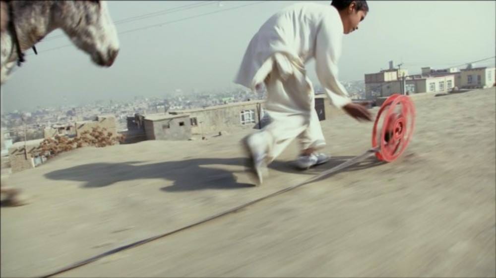 Francis Alÿs (in collaboration with Julien Devaux and Ajmal Maiwandi), "REEL-UNREEL" (2011), single-channel video projection, 20 min. (via facebook)