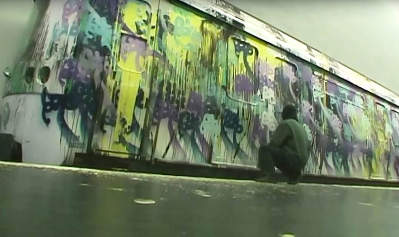 Azyle tagging a Paris subway car (screenshot via YouTube)
