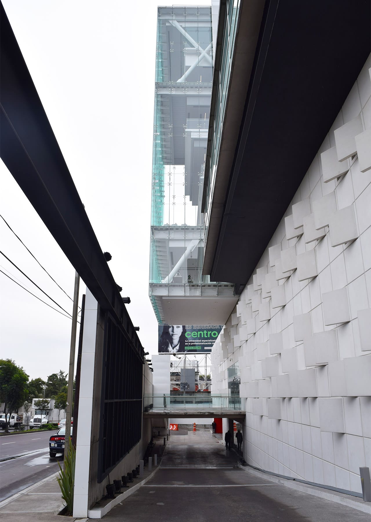 The entrance to CENTRO's campus with part of the library cantilevered above