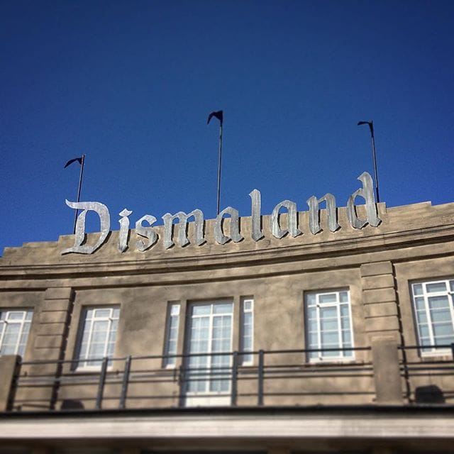 The sign at the entrance to Banksy's 'Dismaland' (photo by @hasslecreative/Instagram)