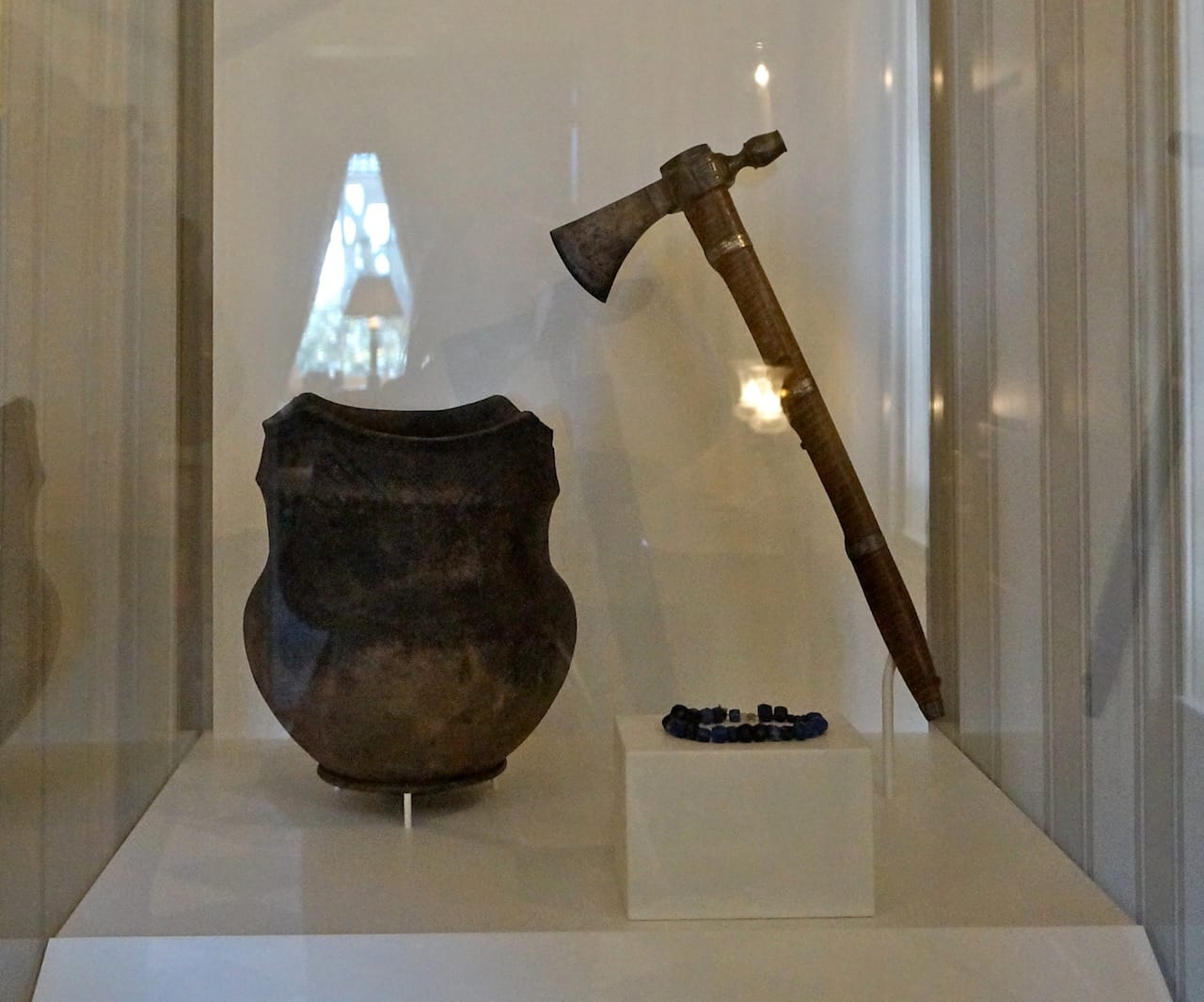 Display case of Native American artifacts at Gracie Mansion, including the pipe tomahawk given at the Big Tree Treaty of 1797 to chief warrior of the Iroquois (courtesy Smithsonian National Museum of the American Indian) (click to enlarge)
