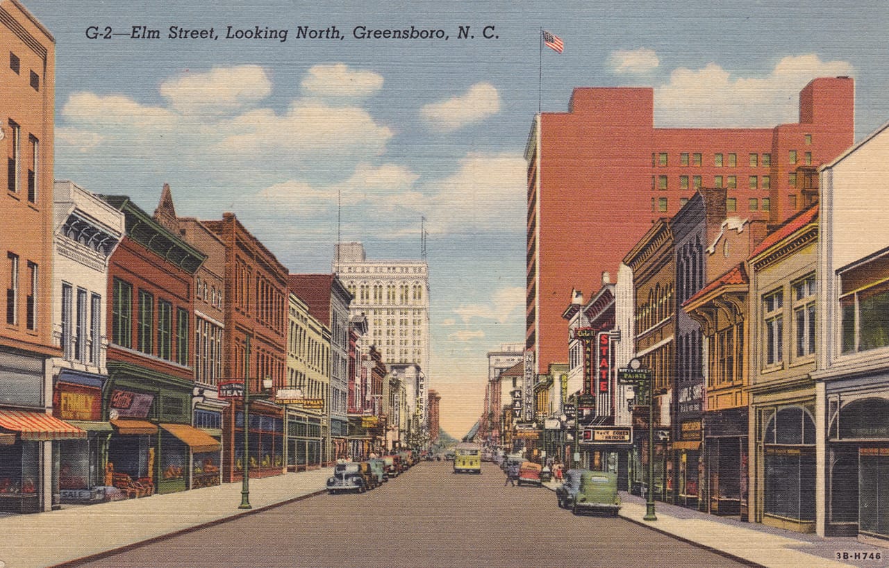 An old postcard showing Elm Street in Greensboro (image via postcardroundup.com)