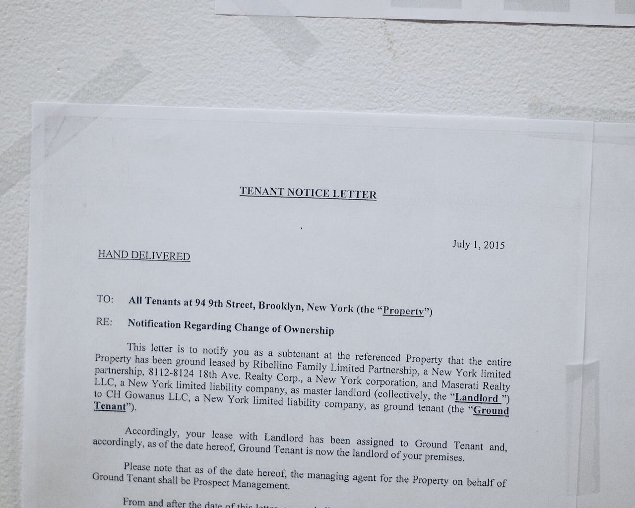 A "hand delivered" notice to tenants posted at 94 9th Street