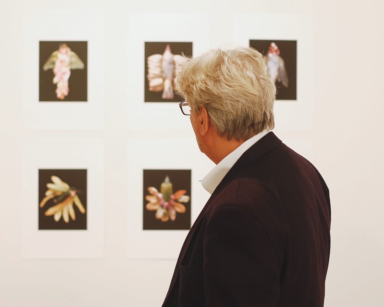 A visitor looking at work during Gowanus Open Studios