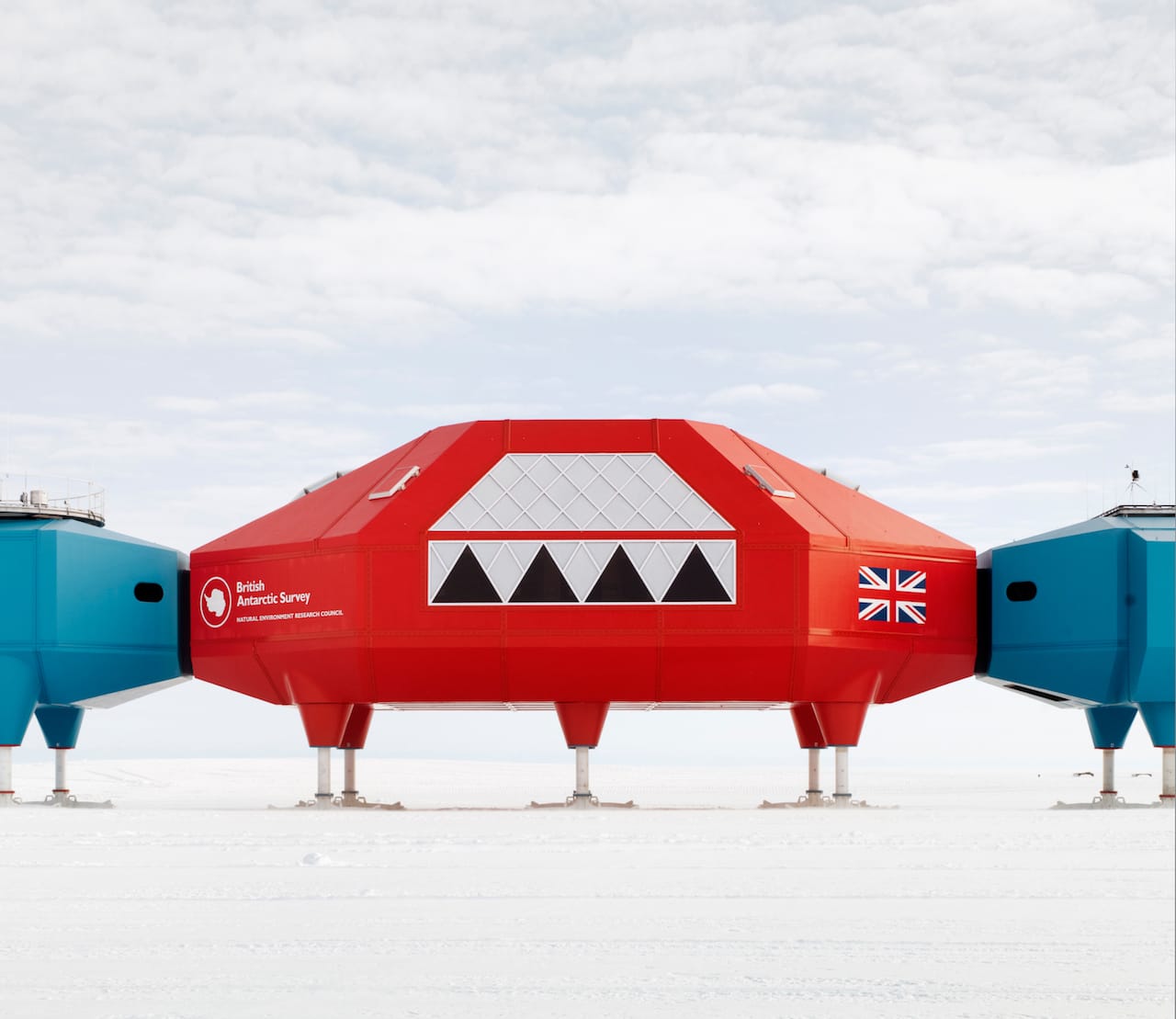 Red double-height social module at the heart of the station. (© James Morris)