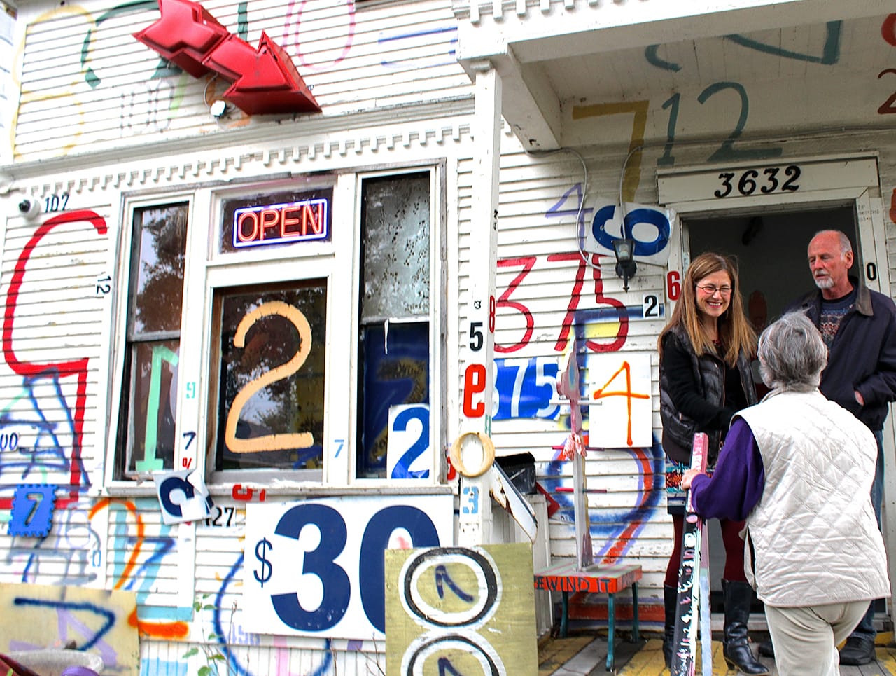 Dickason greets visitors on the "Number House" porch