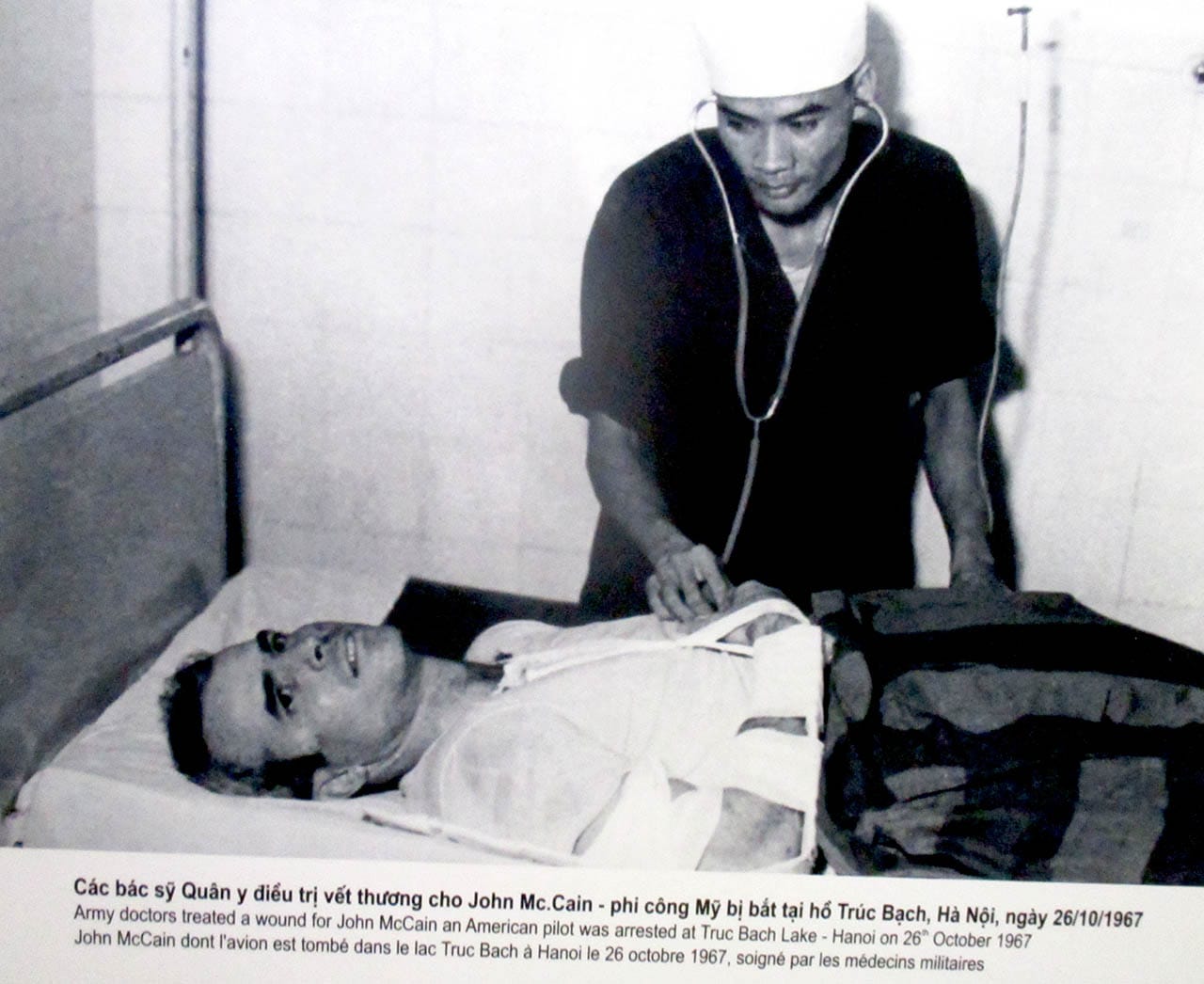 Photo of John McCain being treated by Vietnamese doctors after his capture
