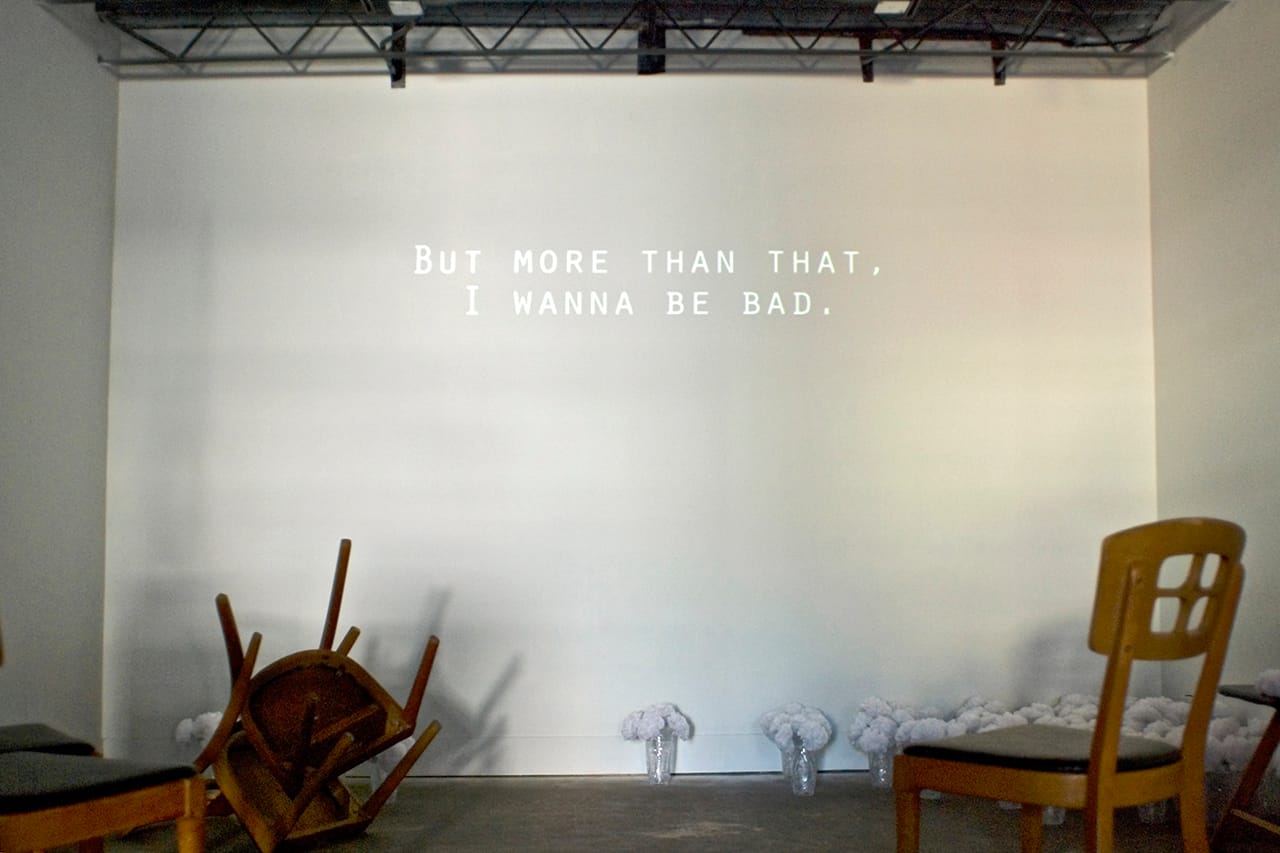 Scott Northrup, still from "The Chapel of Popular Desire" (2015), video, paper flowers, vases, chairs (photo by Miranda Clark)