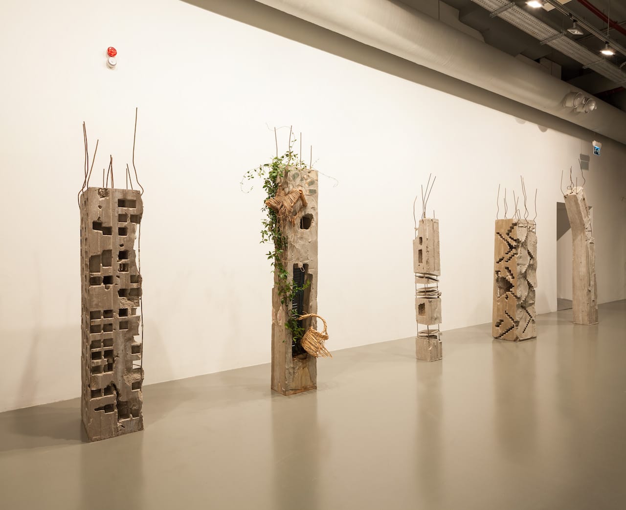 Marwan Rechmaoui, "'Pillar' Series" (2015), 14 pillars, concrete, metal, mixed media (photo by Sahir Ugur Eren)