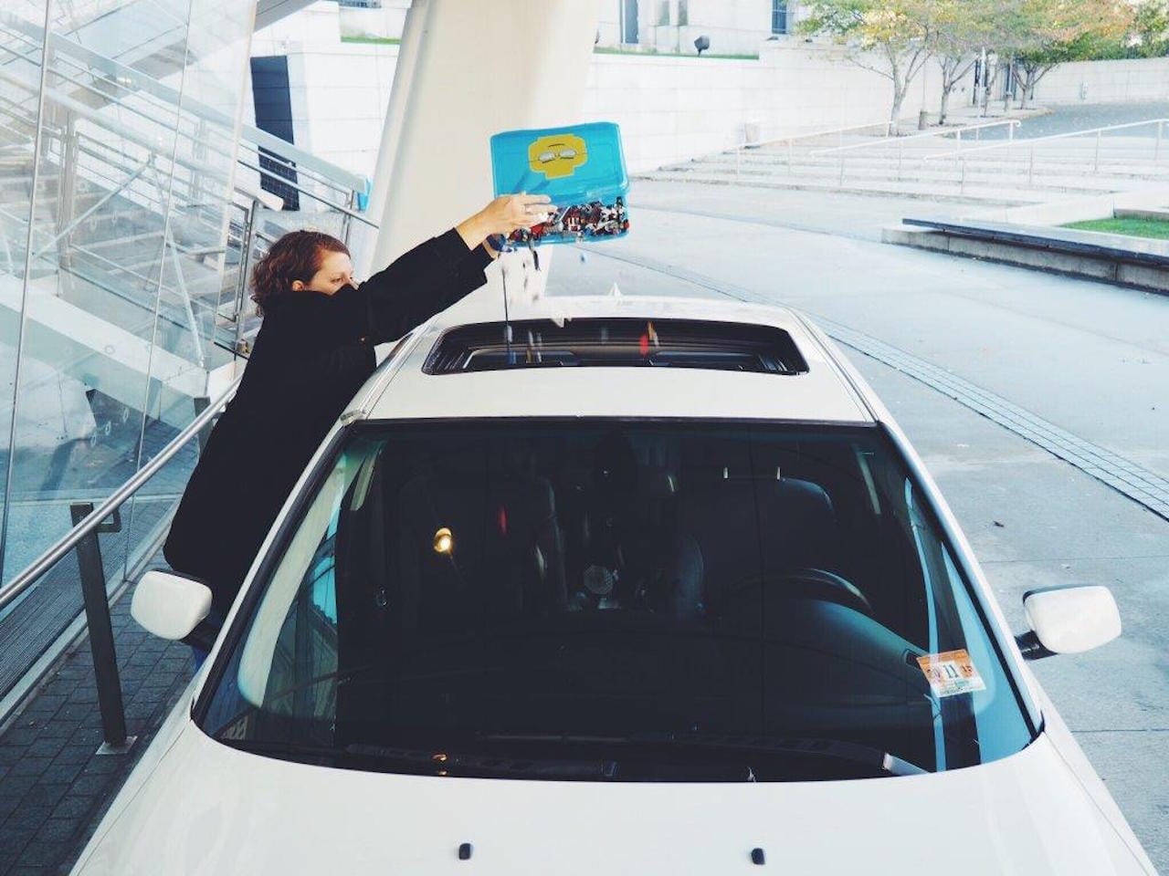 Brooklyn Museum's Vice Director of Exhibitions and Collections Management Sharon Matt Atkins pours LEGOs into the car (courtesy Brooklyn Museum)