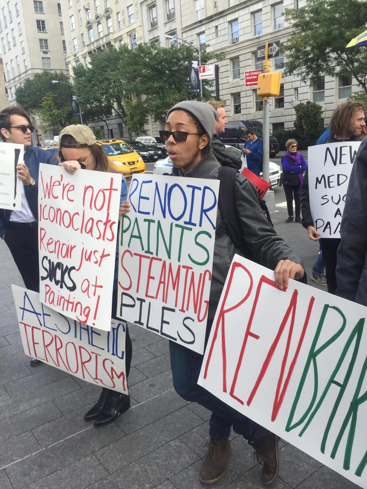 RSAP protestors hold signs outside the Metropolitan Museum of Art (click to enlarge)