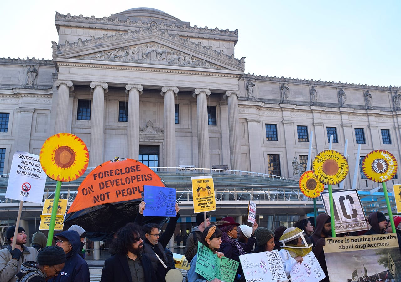 Protesters in front of the Brooklyn Museum during the 2015 Brooklyn Real Estate Summit