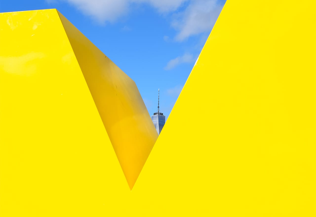 Detail of Deborah Kass's "OY/YO" (2015) with the top of One World Trade Center in the distance