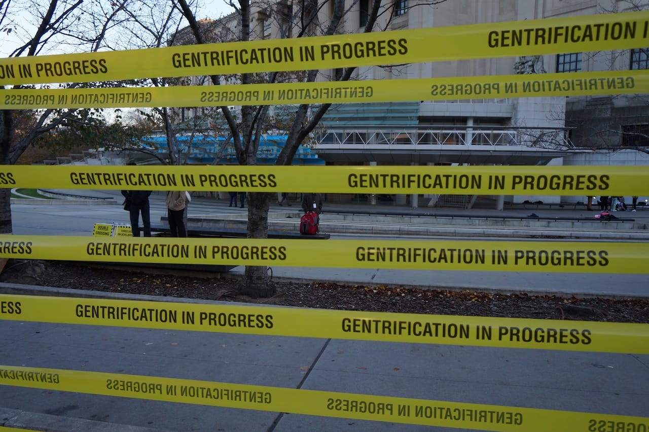 "Gentrification in progress" tape at the "Double Crossing Brooklyn" protest outside the Brooklyn Museum (all photos by the author for Hyperallergic)