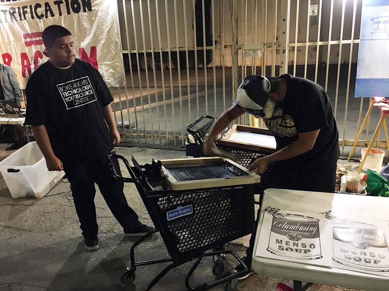 Artist Nico Avina (right) screenprinting at ‘Ambularte’ mobile art exhibit in Boyle Heights, Los Angeles