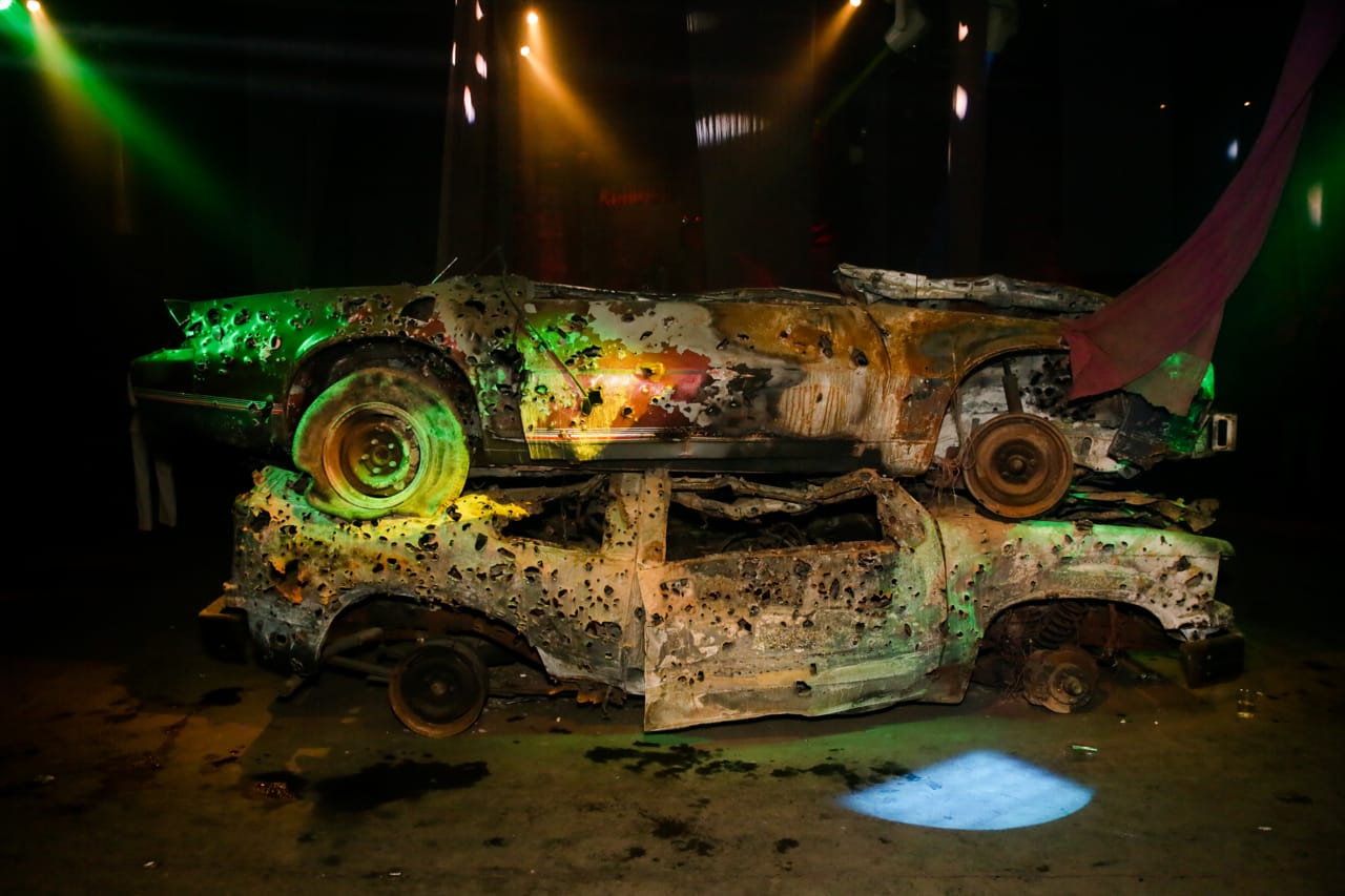 Bullet ridden cars at the Macabre Suite bacchanal. Photo courtesy Will Davis at Nadine Johnson.
