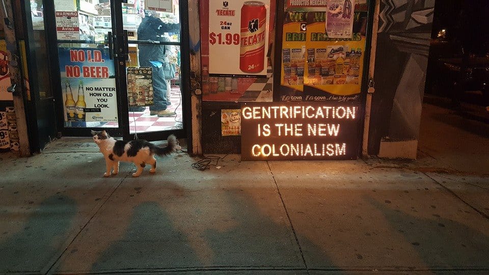 Illumination Against Gentrification signs outside a bodega (all photos courtesy Illumination Against Gentrification)
