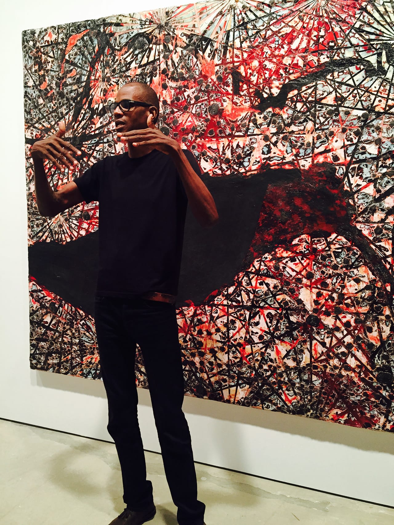 Mark Bradford speaking in front of his painting "Dead Hummingbird" (2015) (click to enlarge)