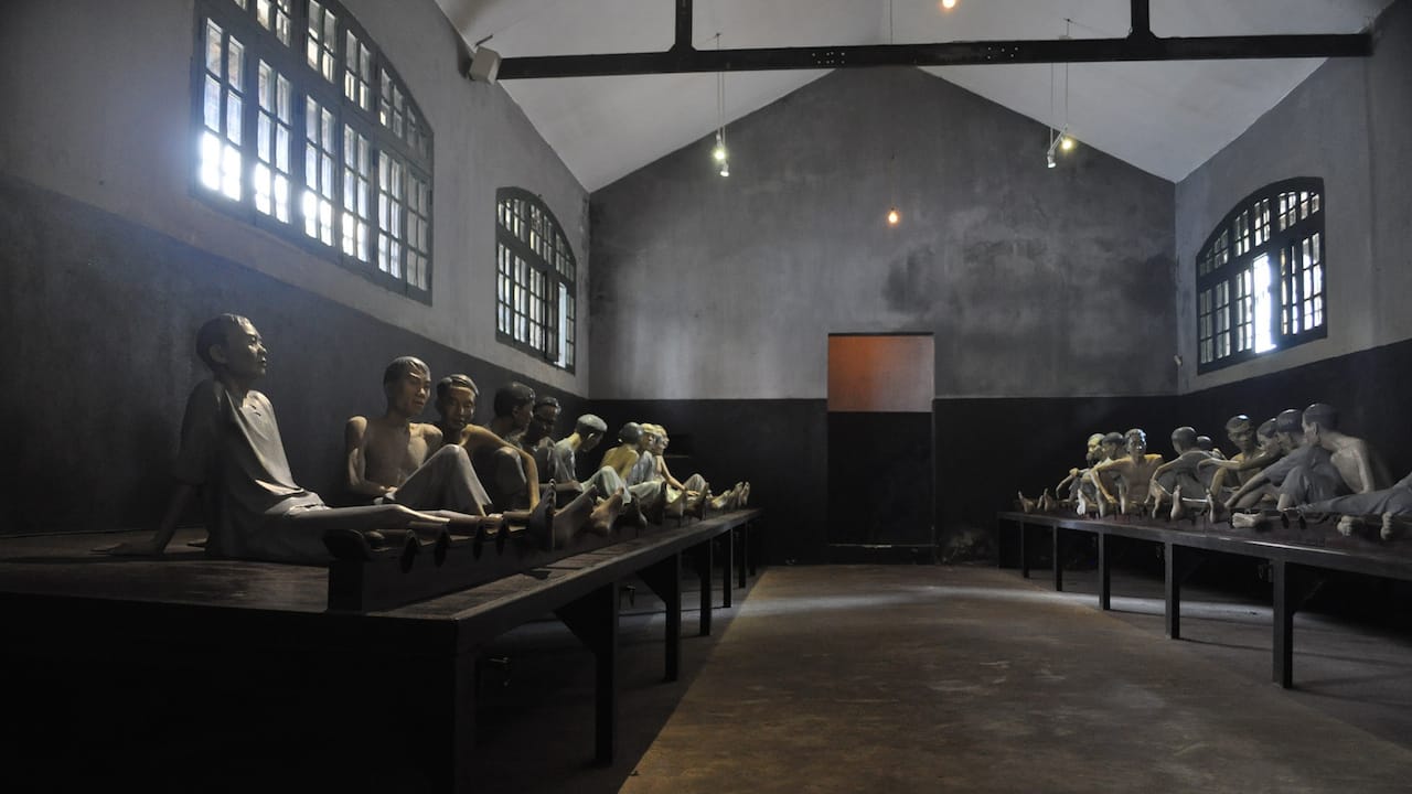 An installation of lifesize prisoner figures at Hoa Lo Prison Museum (photo by David McKelvey/Flickr)