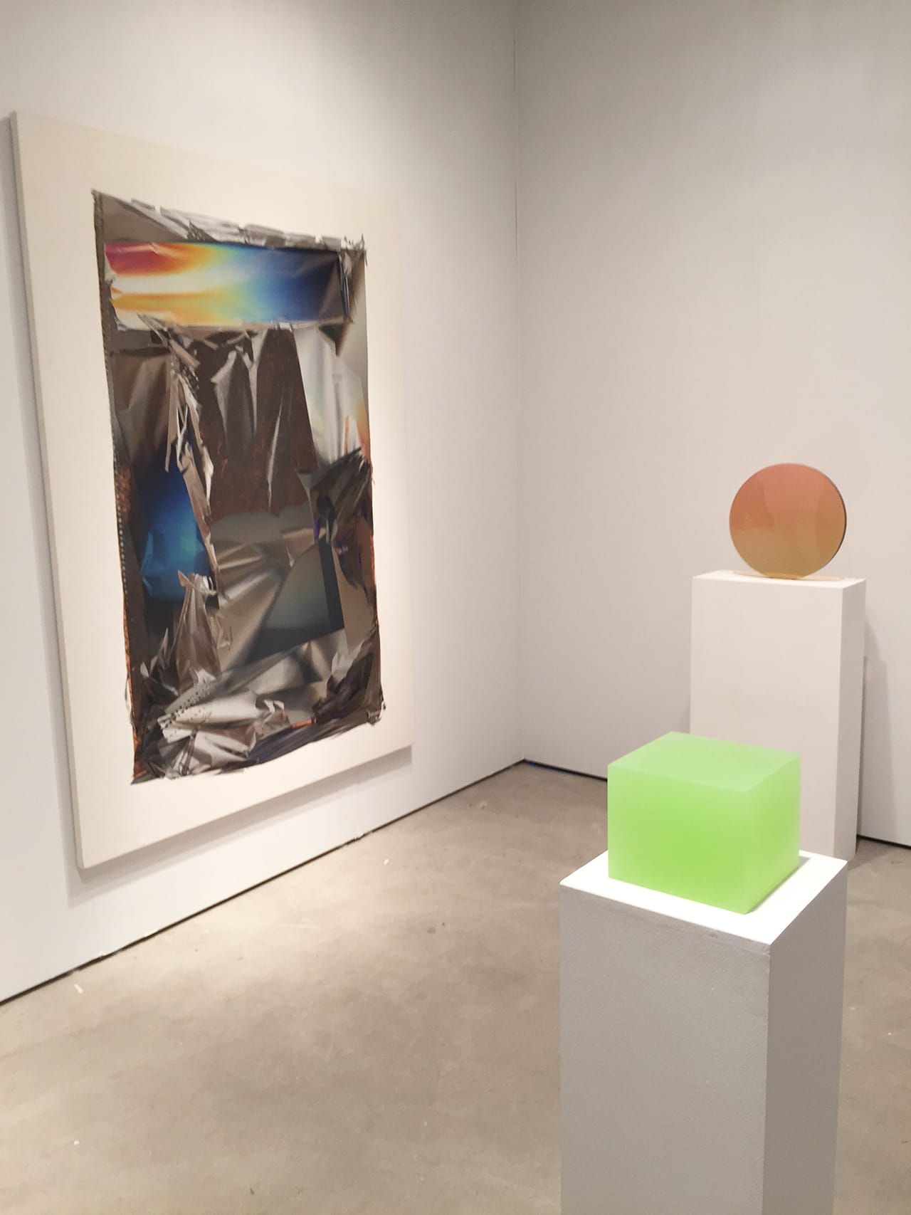 Peter Blake Gallery's booth, with work by Larry Bell at left