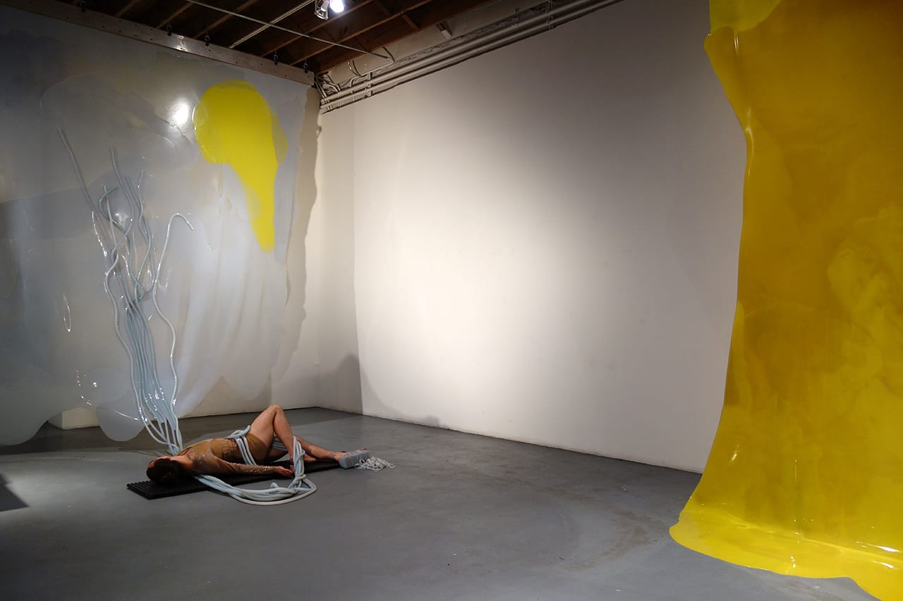 Silas Riener performing with Martha Friedman's 'Pore' at Locust Projects
