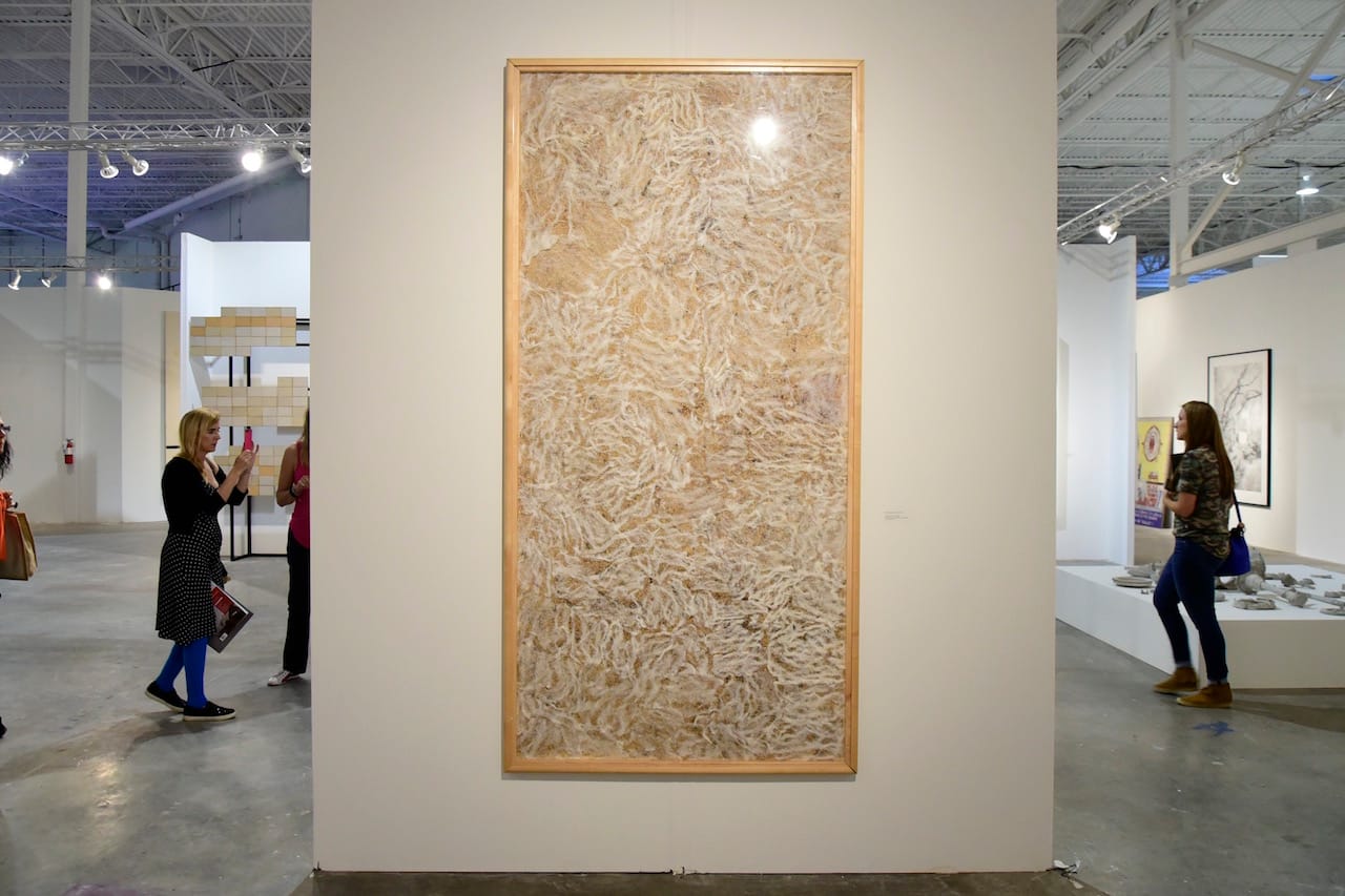 Installation view of 'A Sense of Place' at Mana Wynwood with Tania Bruguera's "El peso de la culpa" (1999) at center (all photos by the author for Hyperallergic)