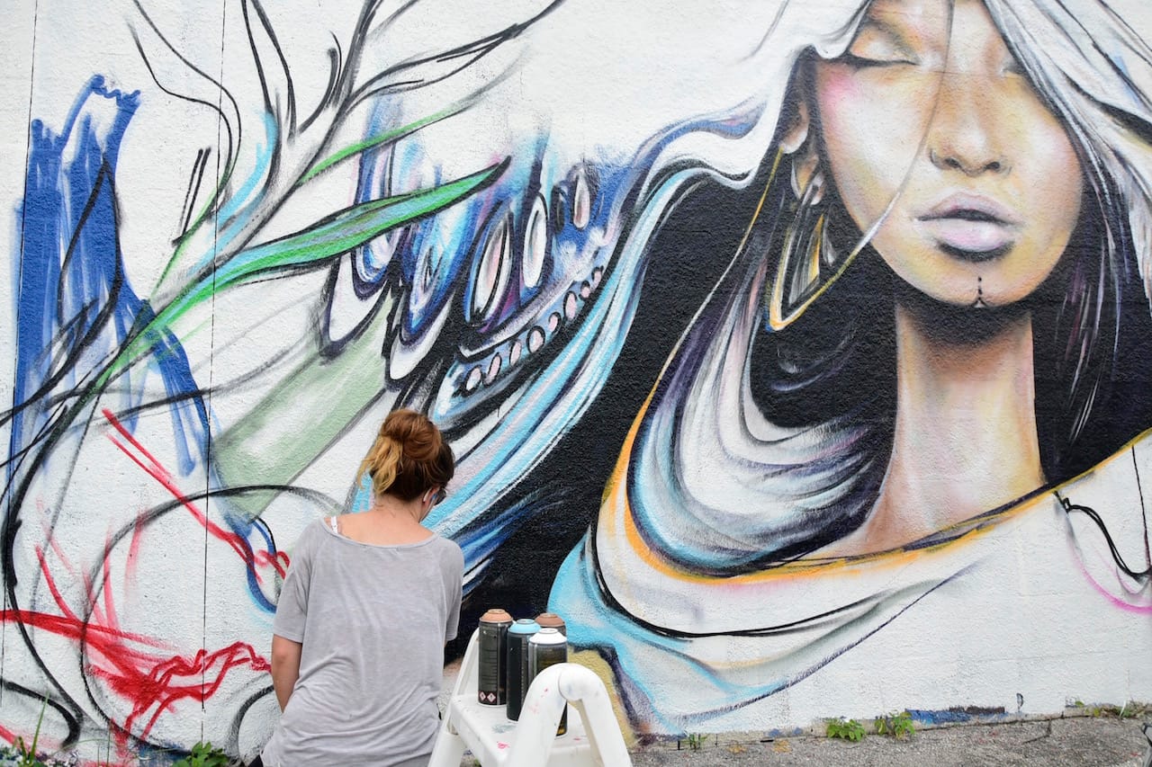 A street artist at work at the former RC Cola plant during Mana Wynwood's 'Urban Art Block Party'