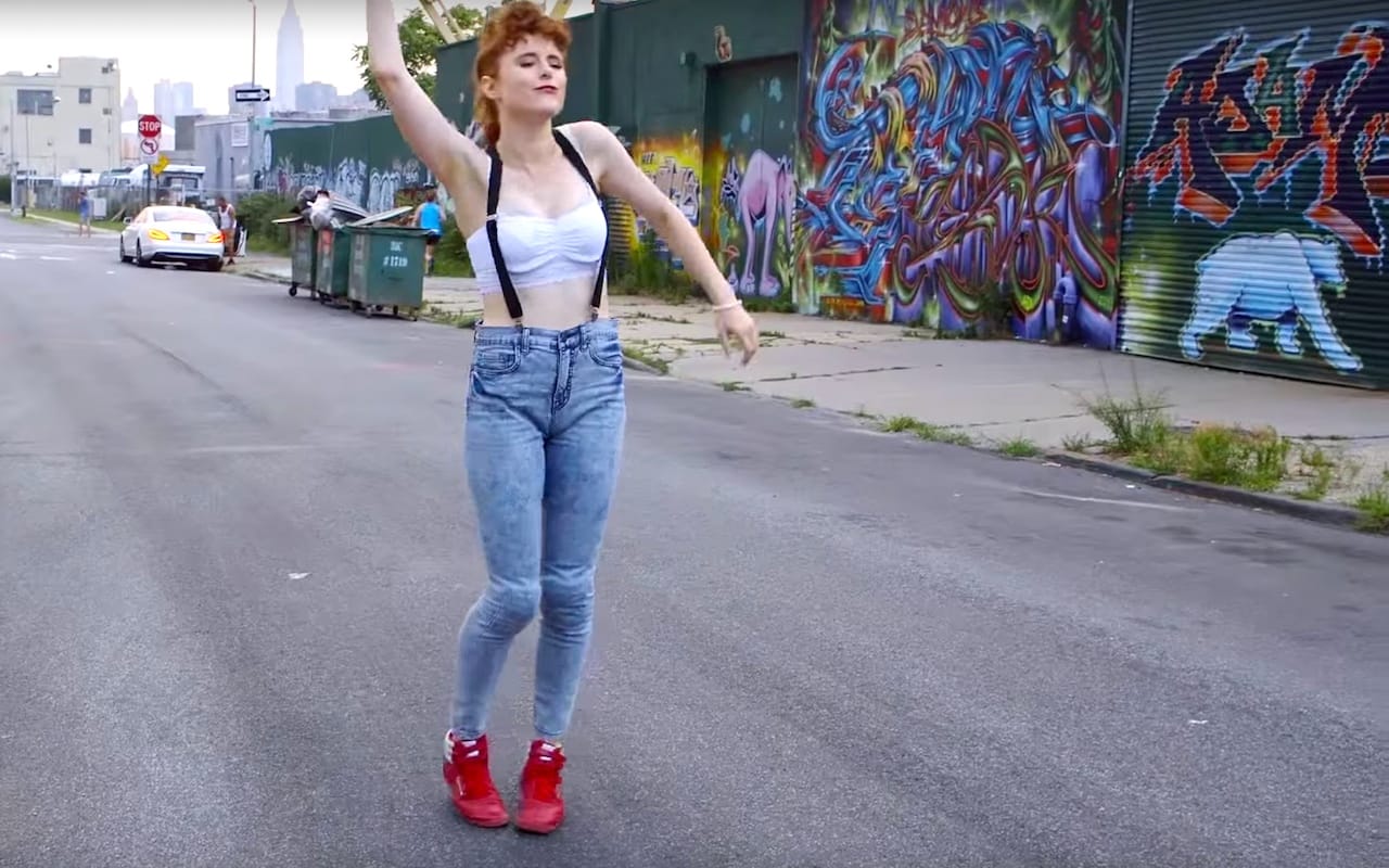 Jamie Hef's murals in the backdrop of Kiesza's "Hideaway" video (screenshot via YouTube)