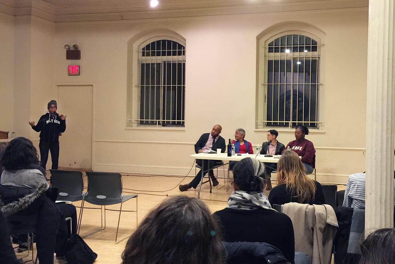 Simone White addresses the audience at the January 6, 2016 "White Room" event at The Poetry Project, New York, NY. Seated at table (left to right): Christopher Stackhouse, Cheryl Clarke, Ariel Goldberg, and Mahogany L. Browne (photo by author for Hyperallergic)