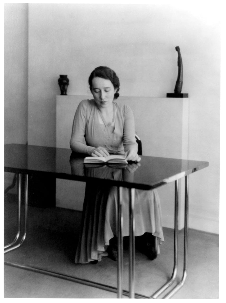 Marga Barr seated at the Donald Deskey table in the Barr apartment, Two Beekman Place (1934)