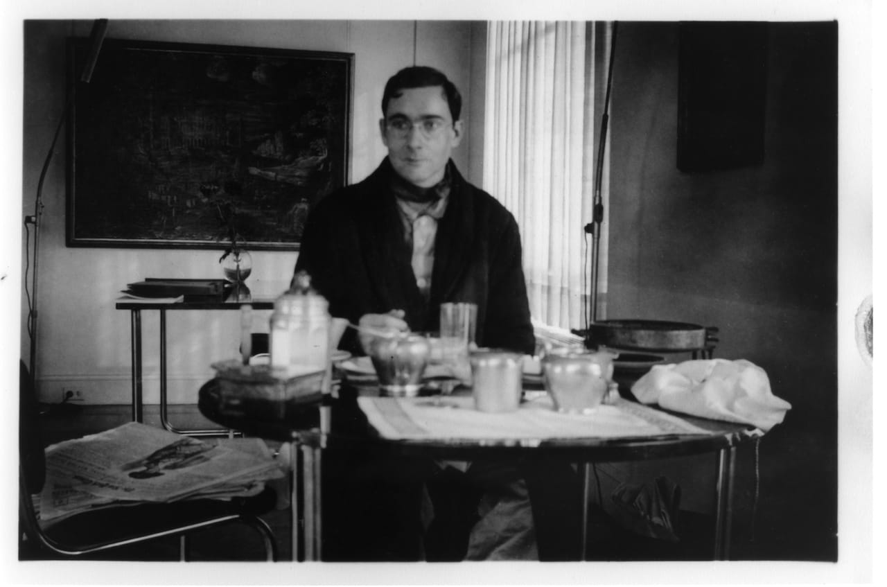 Alfred Barr at breakfast at the round Donald Deskey table, Barr apartment, Two Beekman Place (1934)