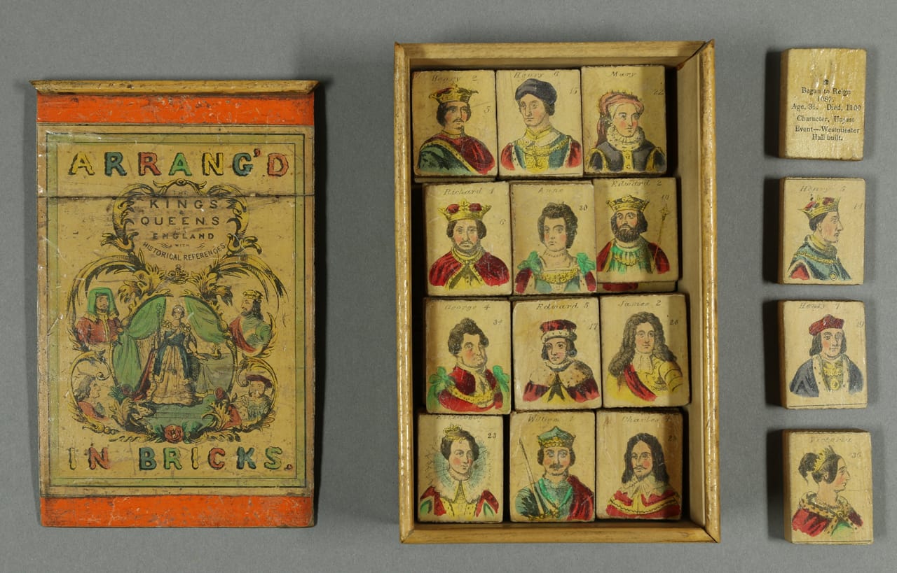 "Arrang’d in bricks: The Kings & Queens of England with historical references" (British, maker unknown, 1840). The 36 blocks are numbered chronologically, representing British monarchs from William I to Queen Victoria.