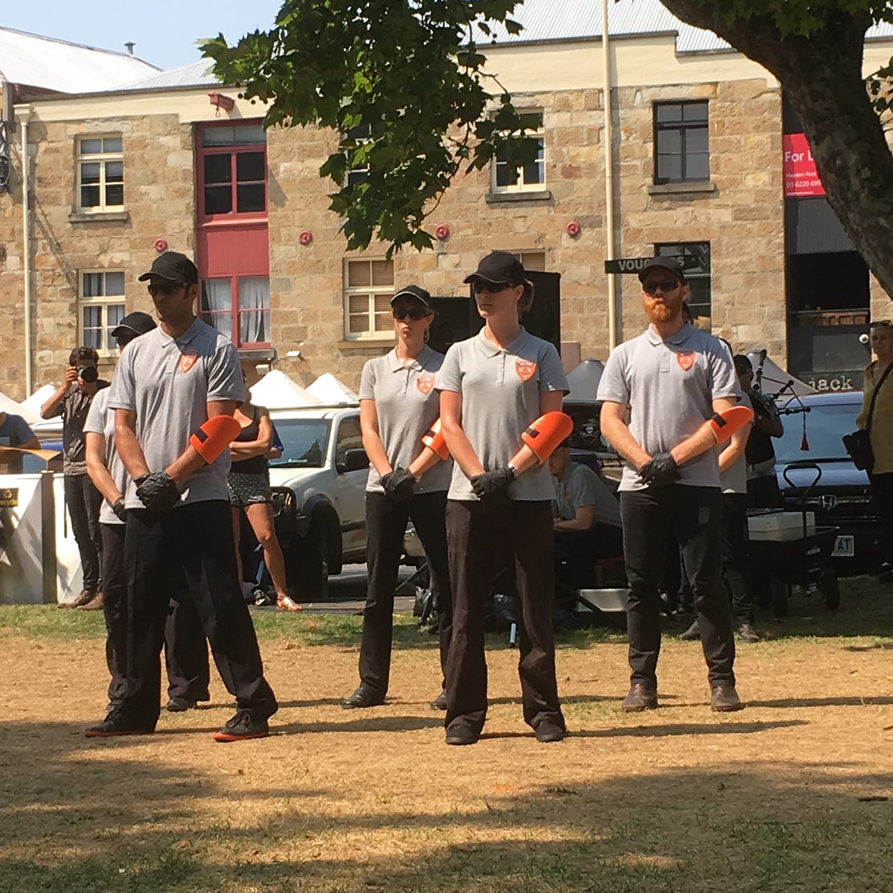 Security guards for Catherine Ryan and Amy Spiers’s “No More Public Space, Only Public Order (Water Cannon)”