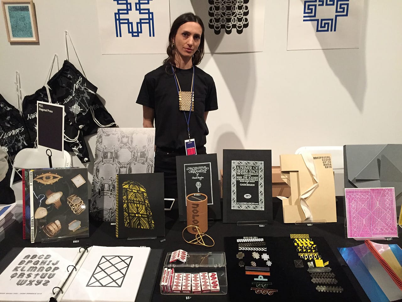 Artist Tauba Auerbach at her Diagonal Press booth