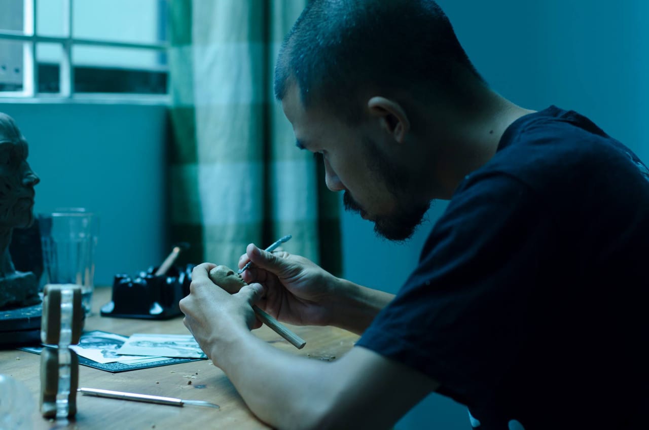 Artist in residence, Pham Dinh Tien, in his studio for San Art Laboratory, Session 5, 2014. All images courtesy San Art.