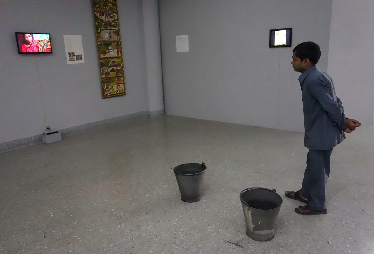 Member of cleaning staff in Birla Academy of Art and Culture captivated by Swarna Chitrakar’s recorded performance