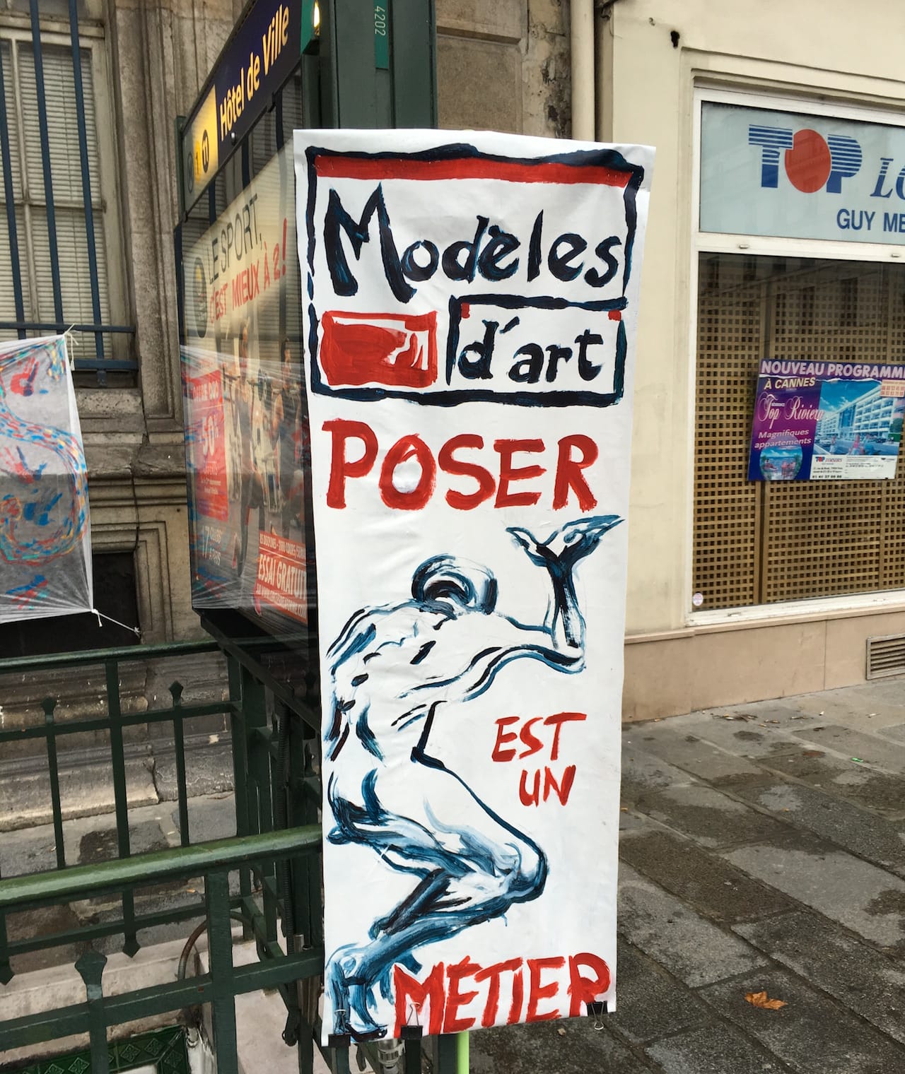 A Collectif des Modèles d’Art de Paris sign at Saturday's protest