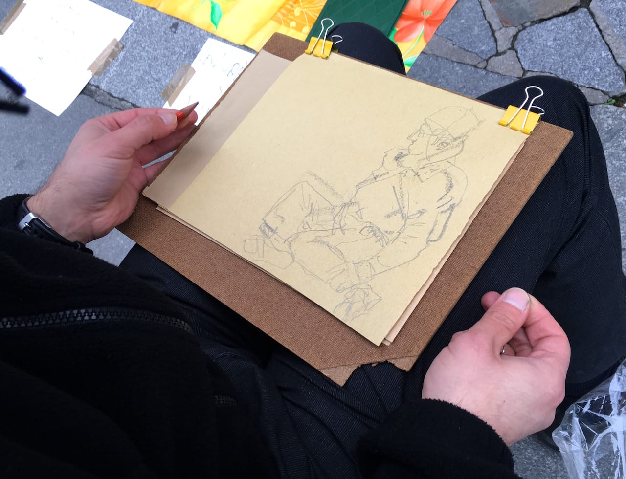 Members of the Collectif des Modèles d’Art de Paris stage a life drawing session in the Place de l'Hôtel de Ville.