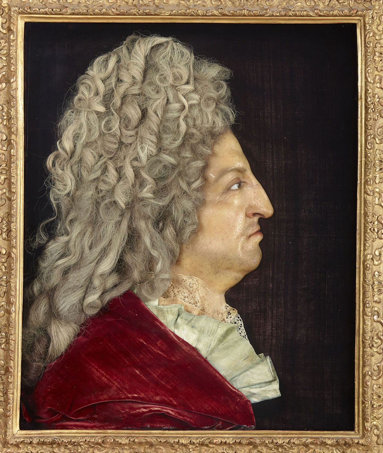 Antoine Benoist, "Portrait of Louis at 68, Seven Years Before His Death" (1706), wax relief with glass, hair, silk, and velour (Château de Versailles, © Chateau de Versailles [dist-RMN-Grand Palais], photo by Christophe Fouin)