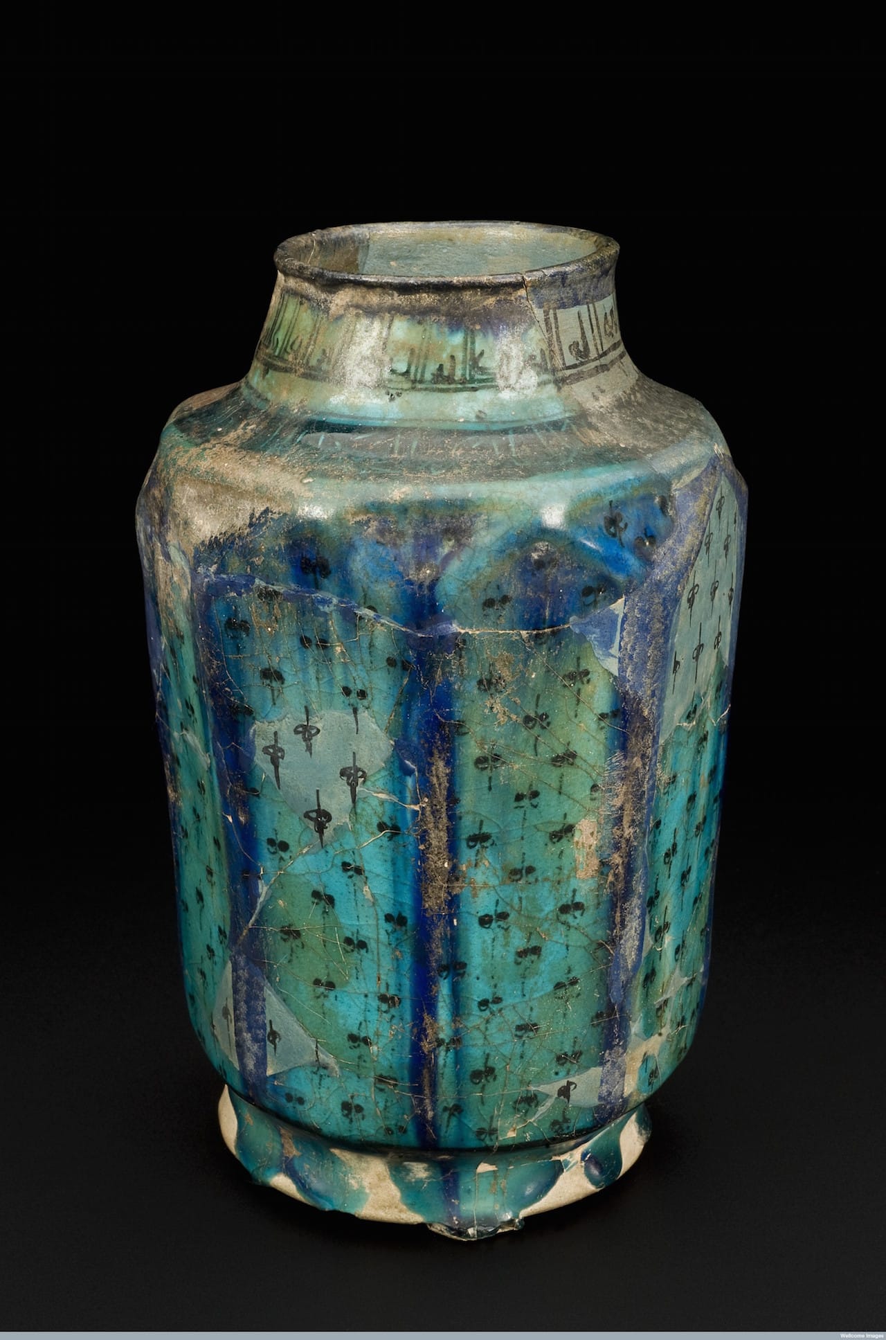 L0057500 Earthenware drug jar, Iran, 1201-1300 Credit: Science Museum, London. Wellcome Images images@wellcome.ac.uk http://wellcomeimages.org The rim and top of this hexagonal drug jar is inscribed with Islamic script. The jar is glazed with a striking turquoise colour. The jar would have been used to hold ingredients for preparations or the actual finished product. The jarís contents would have been protected using an age-old technique ñ a parchment or vellum cover tied off with string. This jar was purchased in Cairo, Egypt, in 1932 by Captain Johnston-Saint, one of Henry Wellcomeís agents who collected on his behalf. maker: Unknown maker Place made: K?sh?n, Esfahan, Iran made: 1201-1300 Published: - Copyrighted work available under Creative Commons Attribution only licence CC BY 4.0 http://creativecommons.org/licenses/by/4.0/
