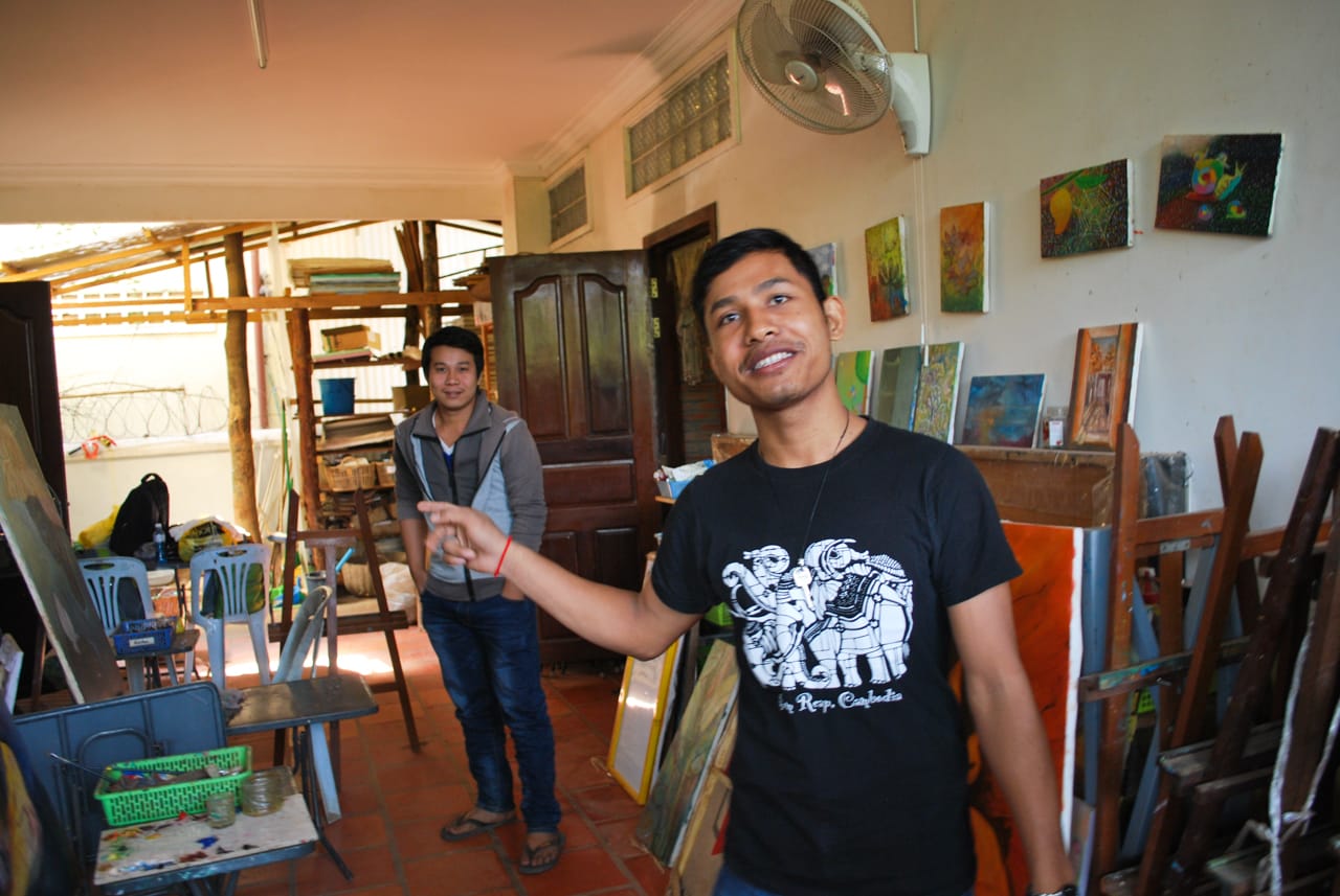 Artists and teachers Em Bandeth at front, and Lim Kunthea in the back, show me around the school.