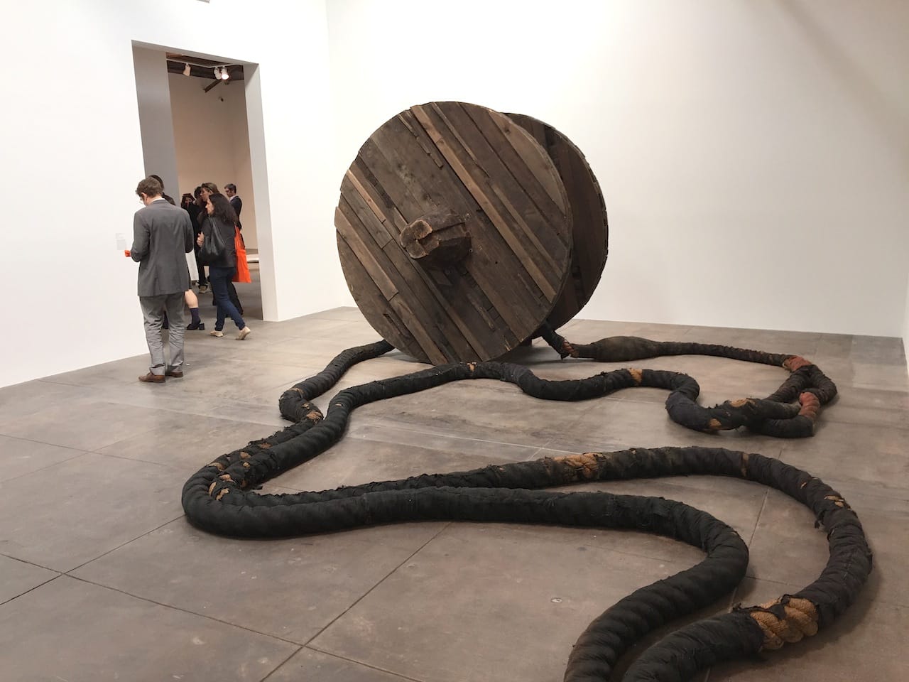Magdalena Abakanowicz, "Wheel and Rope" (1973), Wood, burlap, hemp, metal line, 2 wheels, each: 7ft x 8 1/8 in. (diameter), 2 ropes, each approx. 190 ft.