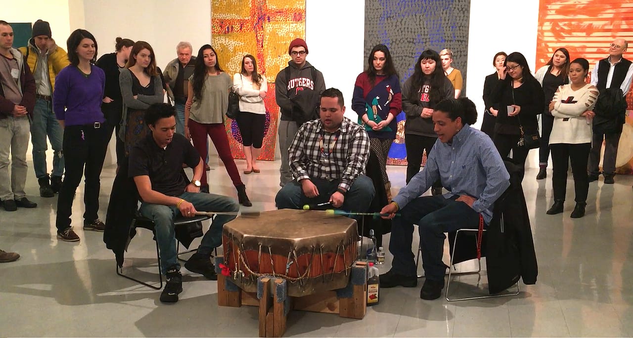Three members Nanticoke Lenni-Lenape Red Blanket Singers (from left: Duncan Munson, Carl Green, and Hassan Ridgeway) at the Rutgers MFA opening, March 4, 2016 (still from video by and © Ardele Lister)