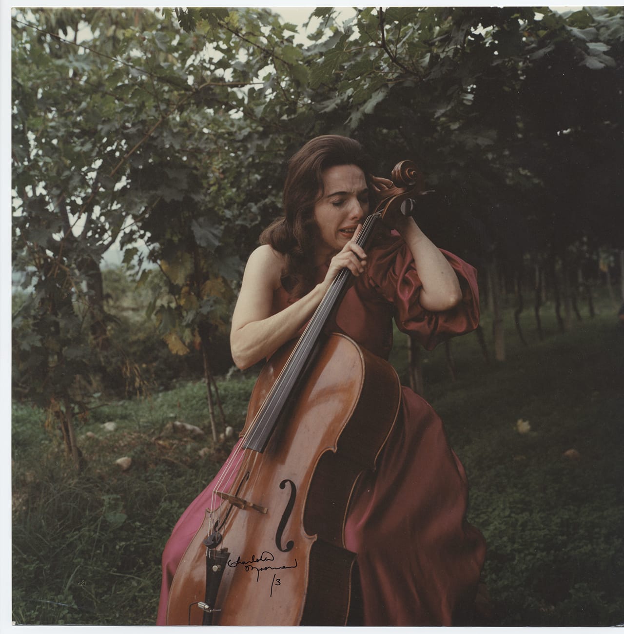 Charlotte Moorman performs Giuseppe Chiari’s 'Per Arco,' Asolo, Italy (c. 1975) (photo by Mario Parolin, courtesy of Charlotte Moorman Archive, Charles Deering McCormick Library of Special Collections, Northwestern University Library)