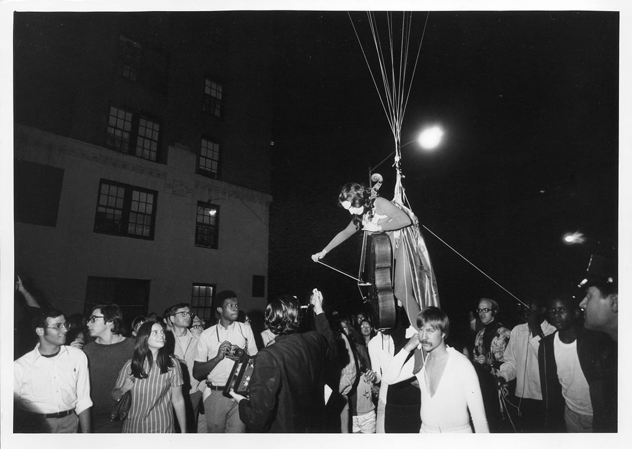 Peter Moore, Charlotte Moorman performs Jim McWilliams’s Sky Kiss, 6th Annual New York Avant Garde Festival, Central Park West, September14, 1968 (photograph © Barbara Moore/licensed by VAGA, NY)