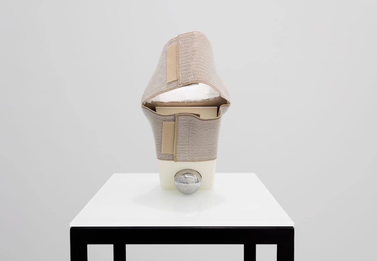 Ross Knight, "Precision Bearing (...) Brace" (2015), urethane, chrome steel, knee brace, plaster glaze, 11.5 x 6 x 9 in