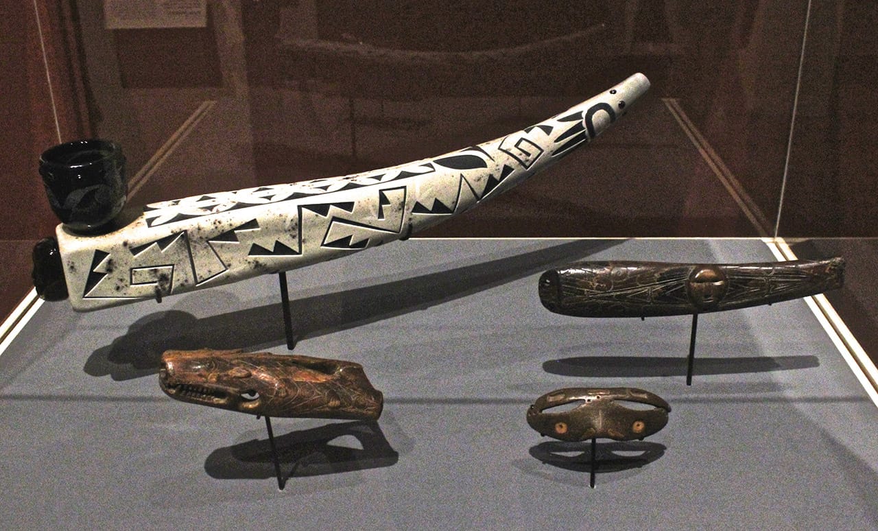 Top left: Tammy Garcia and Preston Singletary, "Ivory Pipe" (2010), blown and etched glass, on display with 2nd- to 5th-century walrus ivory from the Bering Strait region