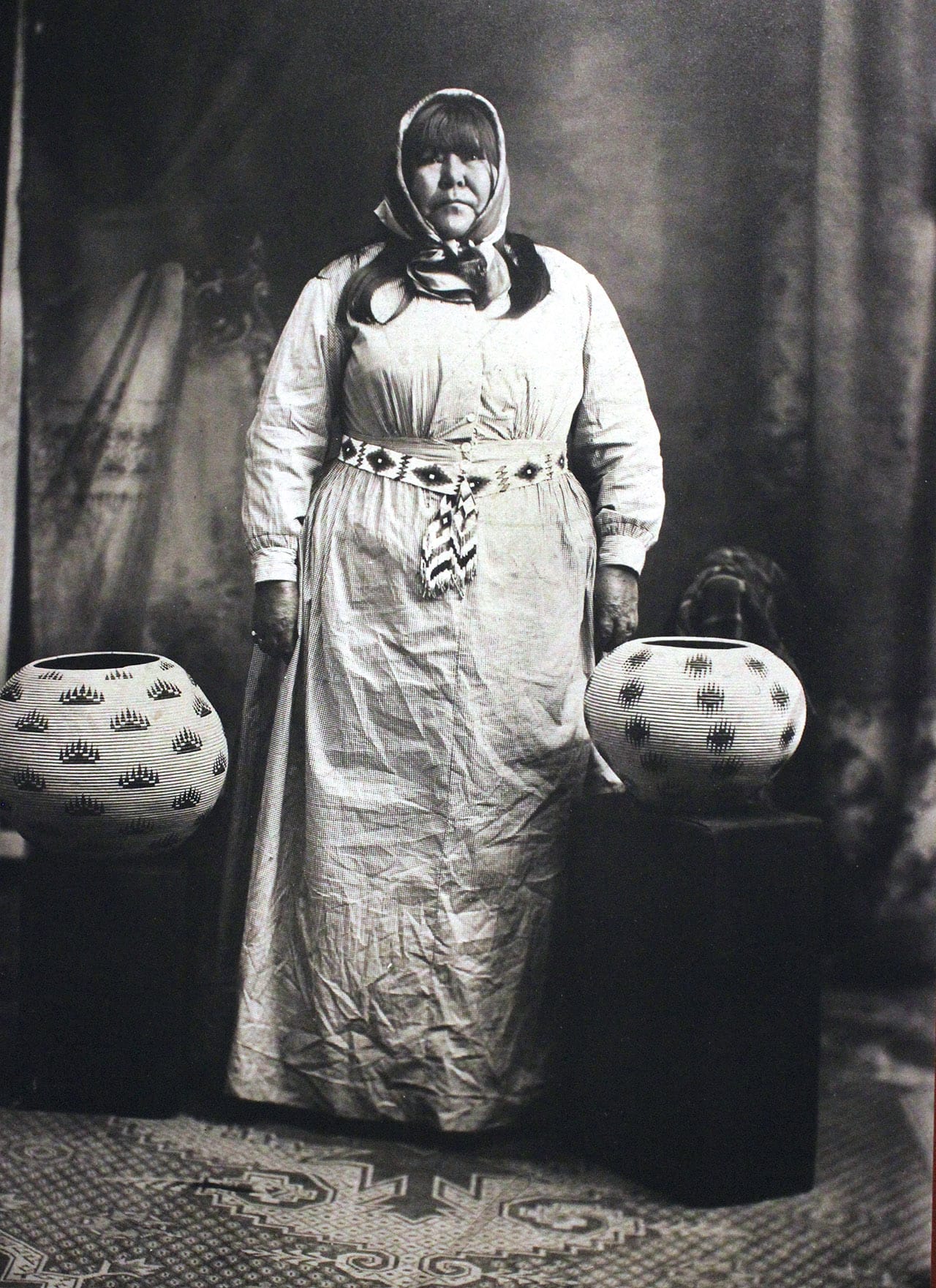 Image of Washoe basketmaker Louisa Keyser (also known as Datsolalee) beside some of her trademark designs (click to enlarge)